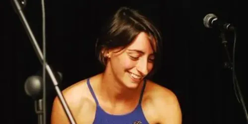 Helen in a march playing samba