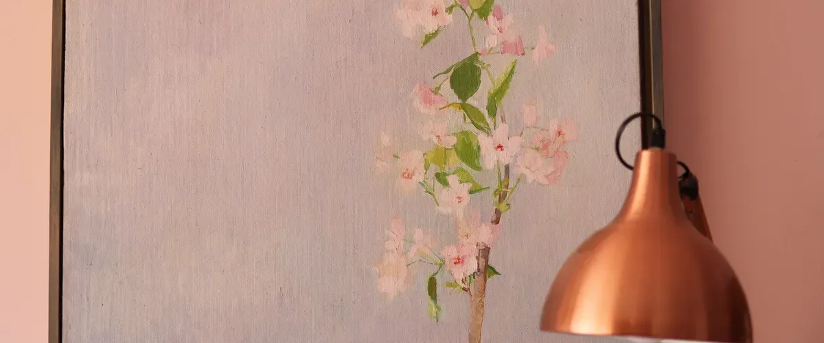 Painting of pink flowers on a blue background